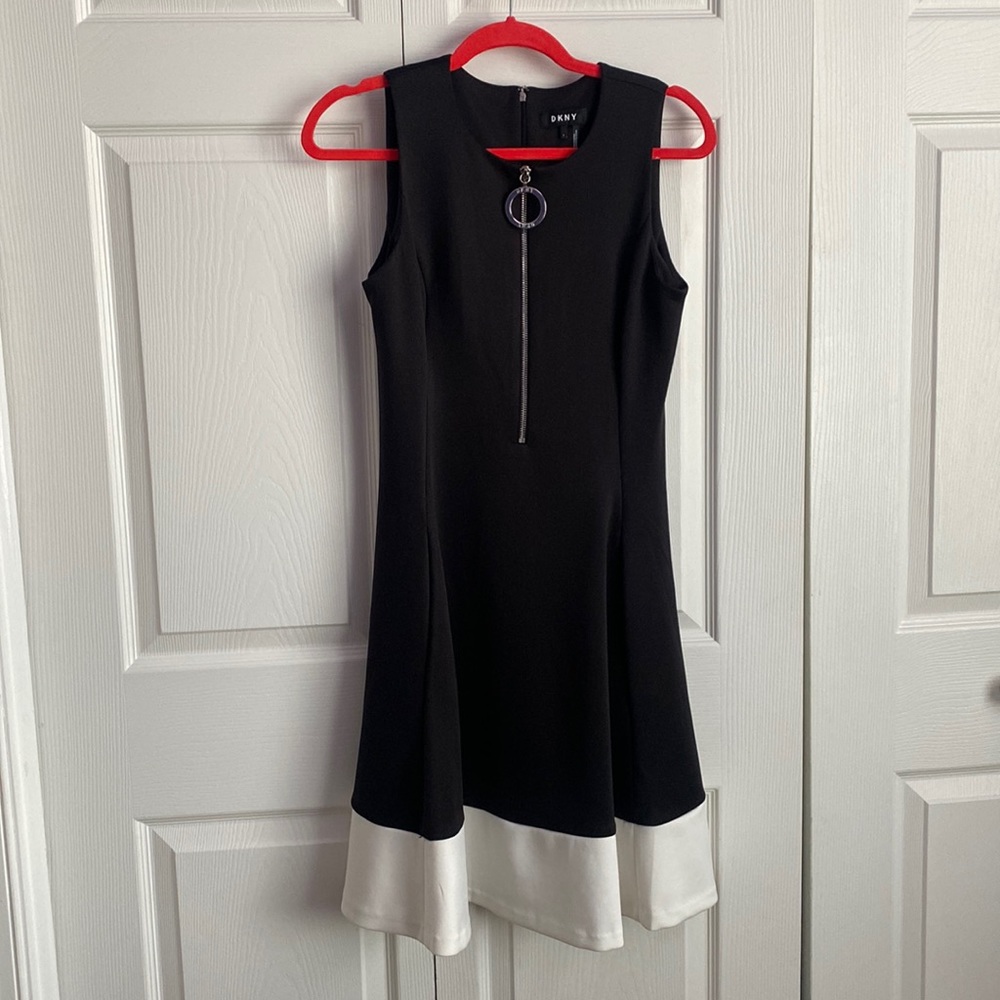 Black dress with white bottom and big zipper front. A classic style